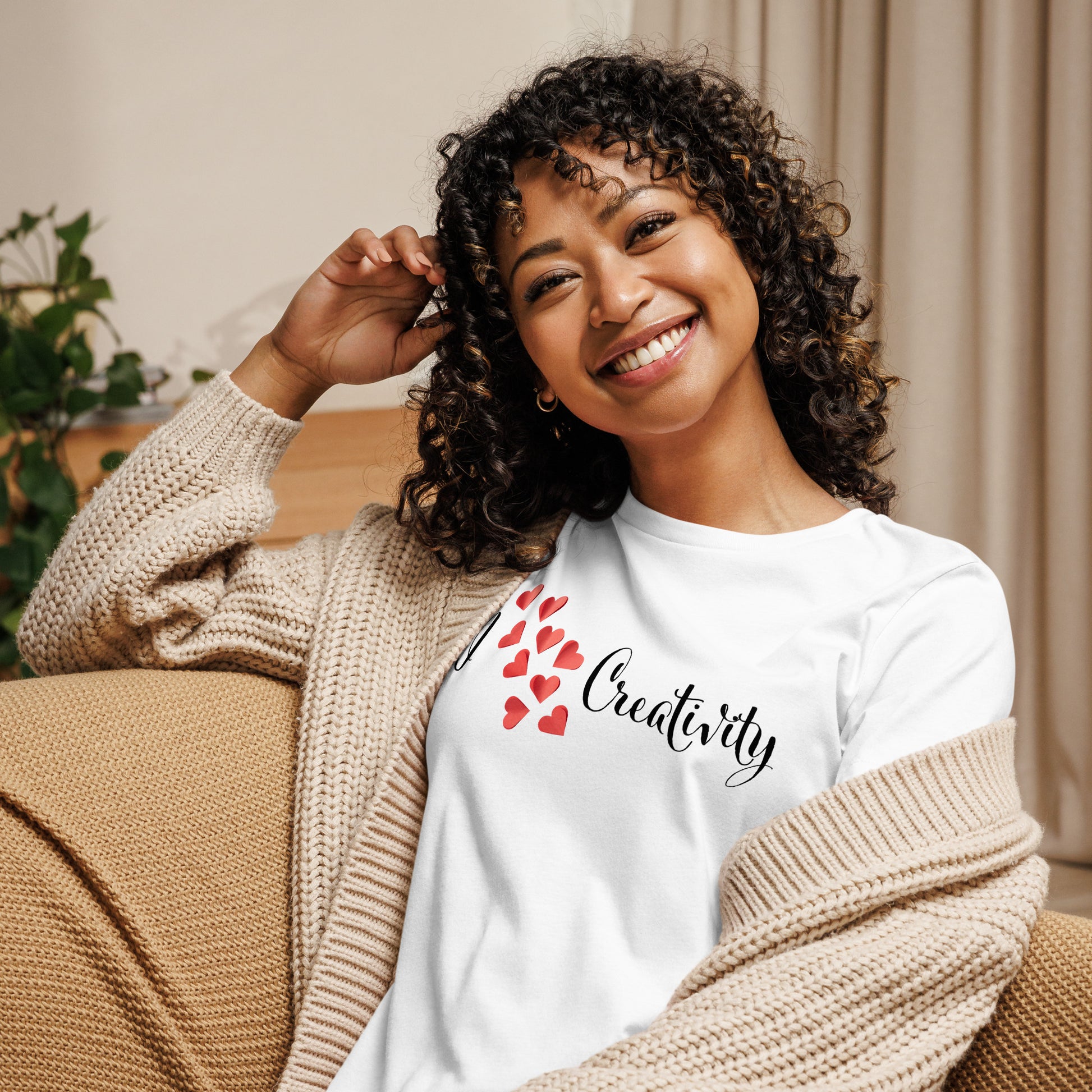 Creative shirt with script text 'I love creativity' and spray of red hearts between words for artists and makers